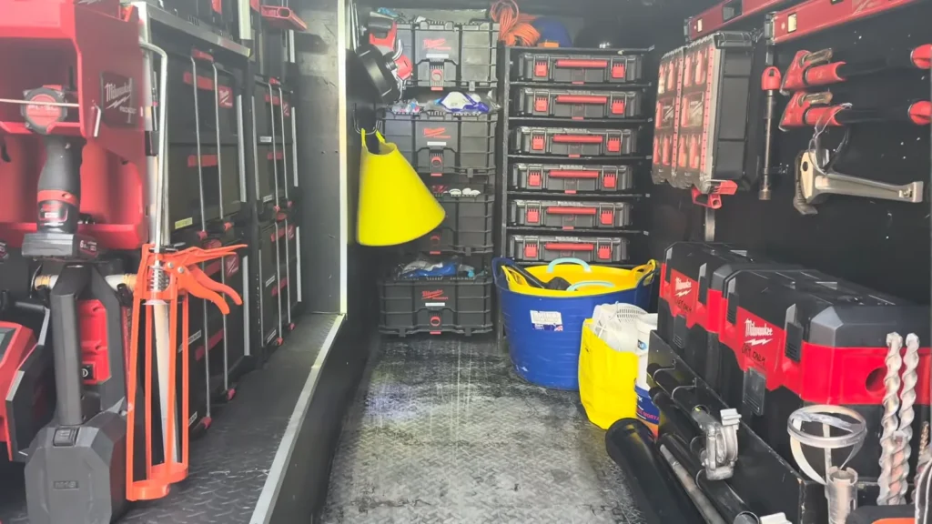 Drain cleaning service van parked outside a job